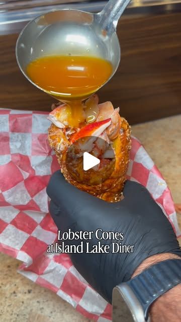 Melted butter ladled over a lobster cone at Island Lake Diner