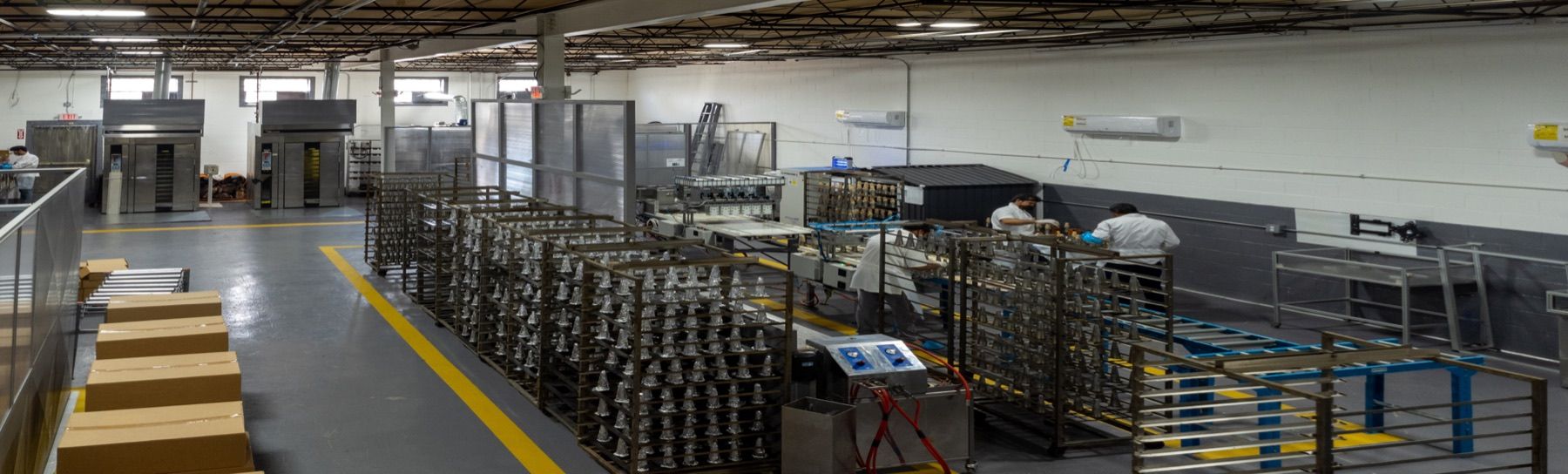 BreadKone's production floor, with racks of cone-forming molds